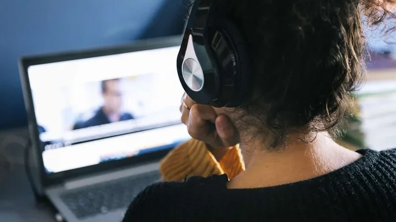 Woman on video call with headphones