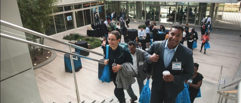 EDI conference break in Geffen Hall, participants walking up the stairs of the courtyard