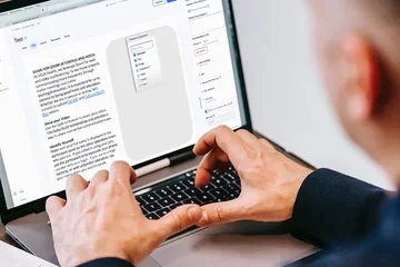 Man on computer typing