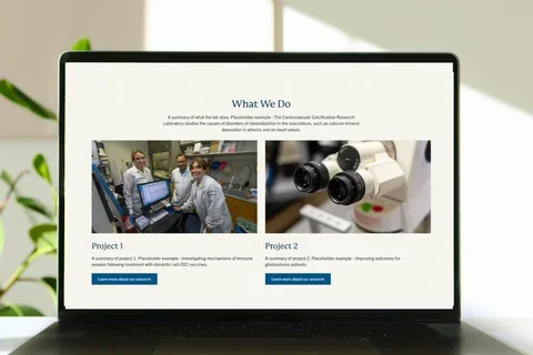 Laptop with lab template homepage below the hero component