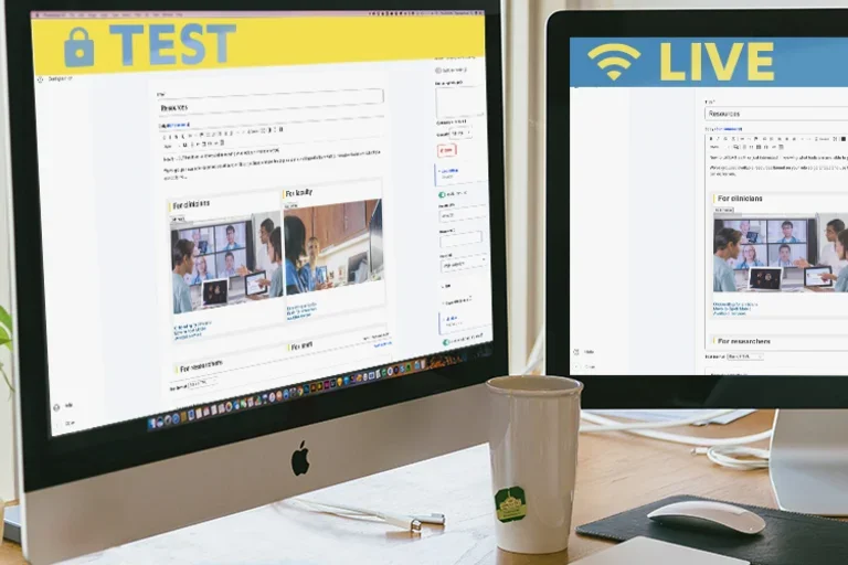 Two computer monitors demonstrating the test and live sites.