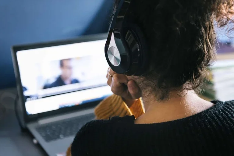 Woman on video call with headphones