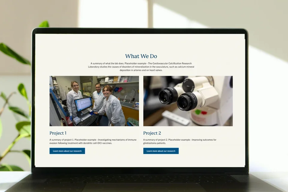 Laptop with lab template homepage below the hero component